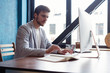 © opolja - Man Working At Computer In Contemporary Office.