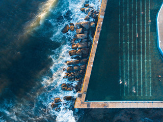 Wall Mural - Top down view of the edge of swimming pool at Collaroy Beach, Sydney, Australia.