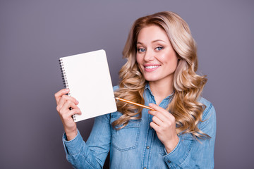 Wall Mural - Close-up portrait of nice cute lovely sweet adorable fascinating charming attractive cheerful wavy-haired lady wearing blue shirt showing empty space isolated over gray pastel background