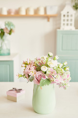 bouquet of flowers in a vase on the table in the kitchen