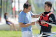 © auremar - instructor checking life jacket is secure on young man