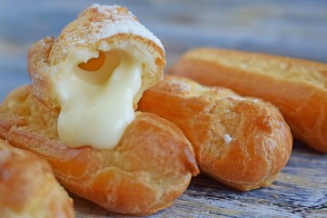 Custard pastry with condensed milk on a white plate.