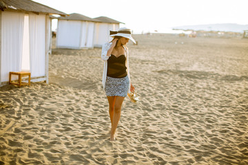 Wall Mural - Young woman posing on the beach