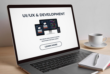 Wall Mural - ui/ux and development concept on modern laptop computer screen