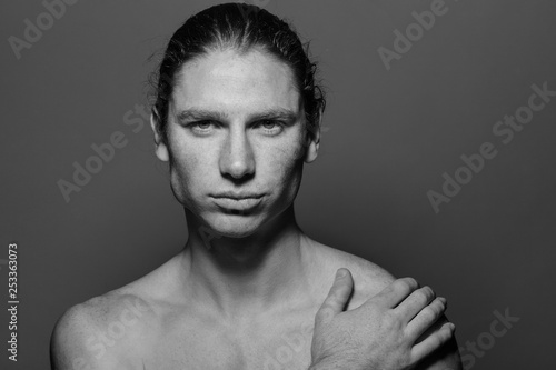 Portrait Of A Muscular Long Haired Man With Drawn Hair And