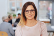 © contrastwerkstatt - Portrait of young woman with modest smile