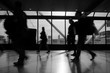 © Matija - Airport rush several people rushing through an airport terminal