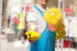 © natali_mis - A worker is holding a cleaning service structure.