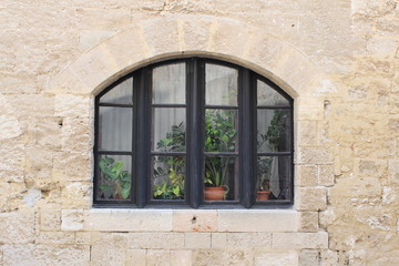 Old window in stone wall