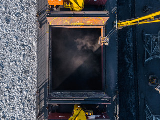 Industrial photo, Loading coal mining in port ship with crane. Aerial top view