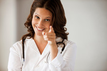 Female Doctor Pointing At The Camera.