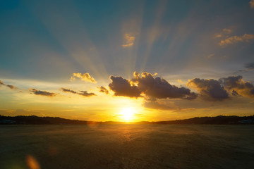 Wall Mural - empty concrete cement floor with beautiful and dramatic golden hour sunset sky .