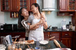 © DragonImages - Mother and daughter cooking breakfast