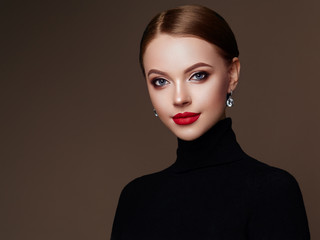 Wall Mural - beautiful young woman with clean fresh skin. perfect makeup. beauty fashion. red lips. cosmetic eyes