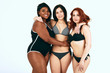 © alfa27 - Indoor studio shot of three satisfied smiling mixed race women spend time together in pool, pose for common photo in swimmimg suits against white background. Body positive.