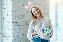 Easter's My Favorite Holiday!Beautiful Young Woman With Basket Of Easter Eggs.