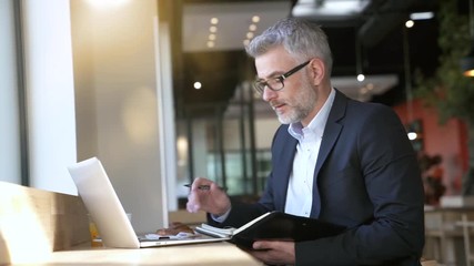 Wall Mural - Businessman preparing meeting in modern office space