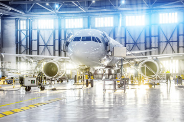 Wall Mural - Aircraft on maintenance of engine and fuselage repair in airport hangar