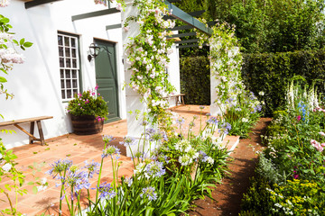 Wall Mural - Garden landscape with flowerbed and entrance area