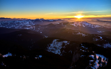 Amazing sunset view from Ceahlău Mountains National in winter season,Aerial winter Landscape