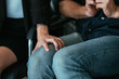 © golubovy - Employer and employee. Harassment behavior. Business woman hand on subordinate man knee.
