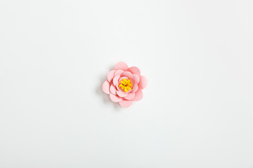 Sticker - top view of pastel paper flower on grey background