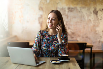 Wall Mural - Woman with mobile phone at cafe