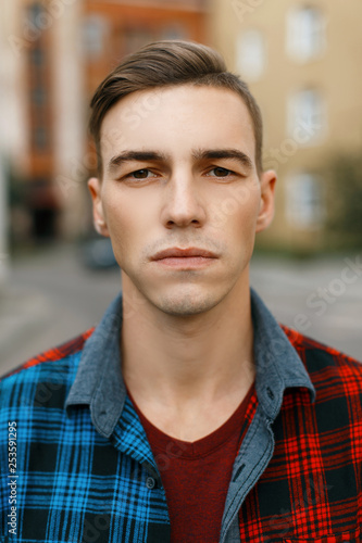 Young Serious Man With A Stylish Hairstyle In A Fashionable T
