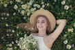 © Olena_Molchanova - Beautiful woman enjoying field of spring daisy