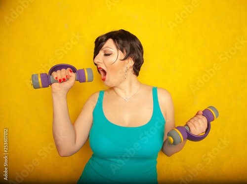 Chubby Joyful Emotional Girl With Short Hair In A Blue T Shirt