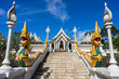© evgenydrablenkov - Staircase and front view of Wat Kaew Korawaram white temple in Krabi Town in Thailand on blue sky in sunny day