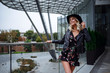 © selenit - A beautiful young blonde woman walks in the Zaryadye Park, Moscow.