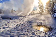 Morning Reflections In A Thermal Pool As Steam Rises On A Winter Day In Yellowstone National Park