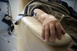 © Shu - Buenos Aires, Argentina - March 08, 2019: Unidentified hand connected to a chemotherapy treatment in Buenos Aires, Argentina