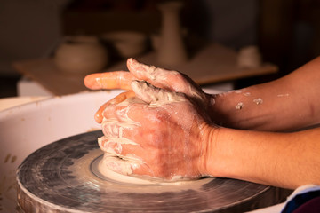  Professional potter making bowl in pottery workshop