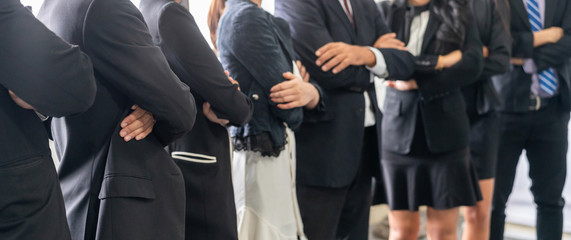 Many business people meeting standing in row with arms crossed and confident. Company organization employee unity and support. Concept of corporate partnership and human resources growth management.