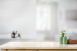 Ceramic shampoo bottle with white towels on marble counter in bathroom background