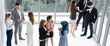 © InfiniteFlow - Many business people gathering in modern office building for business conference in the city. Businessmen and businesswomen communication and human resources concept.