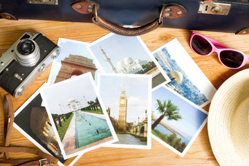 Old retro pictures and camera on wooden table globetrotter photography travel concept