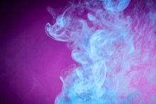 Fog Colored With Bright Blue Gel On Dark  Pink Background..