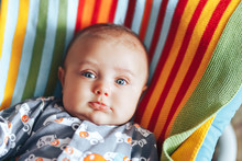 Nice Beautiful Baby Look At Camera Portrait On Colourful Plaid