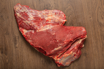 Wall Mural - Raw fresh beef on a wooden background, catalog.