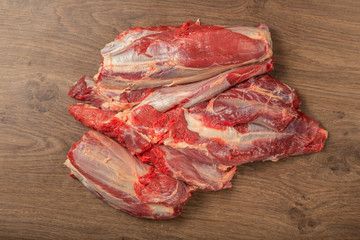 Wall Mural - Raw fresh beef on a wooden background, catalog.