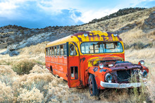 Rusty Colorful Old Bus In Nevada Ghost Mining Town, USA