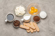 © Anatoly Repin - Ingredients for cooking tiramisu Savoiardi biscuit cookies, mascarpone, cream, sugar, cocoa, coffee and egg