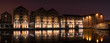 Gloucester Docks at night time with reflections of warehouse