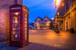 Telephone box in Evesham town with old building in the background