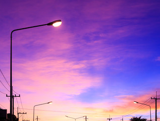 Wall Mural - Streetlight with highlight on fantasy sky background and pink clouds after sunset