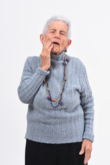 Wall Mural - Senior woman with toothache on white background