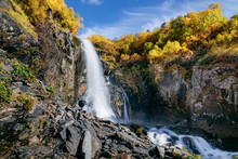 Waterfall In The Mountains In The Fall. Chuchhursky Waterfall, Dombay, Caucasus